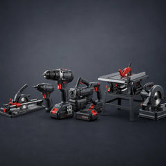 A set of cordless power tools and table saws in a dark studio setting, including a circular saw, drill, impact driver, cordless brush cutter, and table saw with a red blade guard.